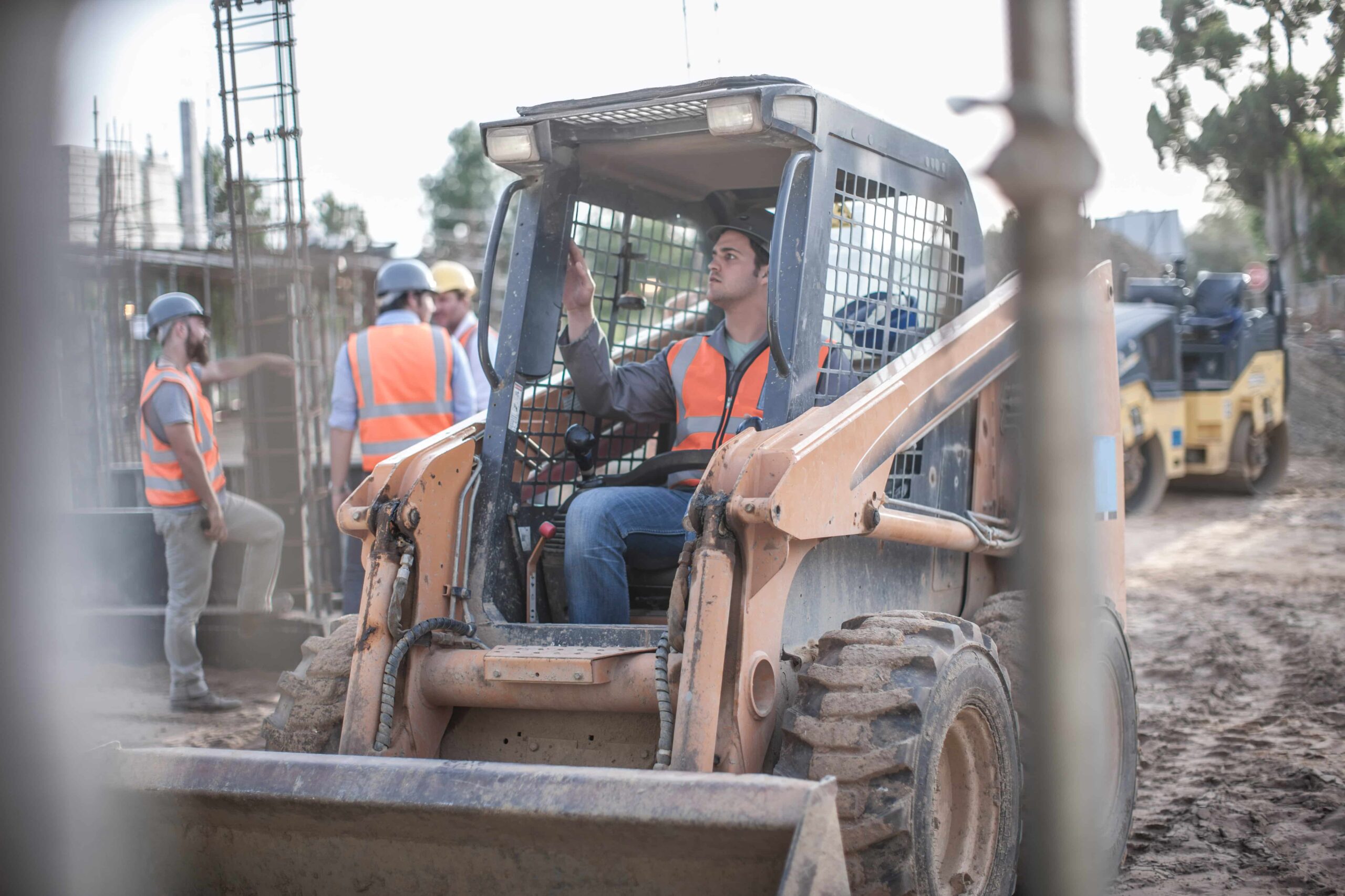 construction-worker-driving-excavator-on-construct-2023-11-27-05-32-36-utc