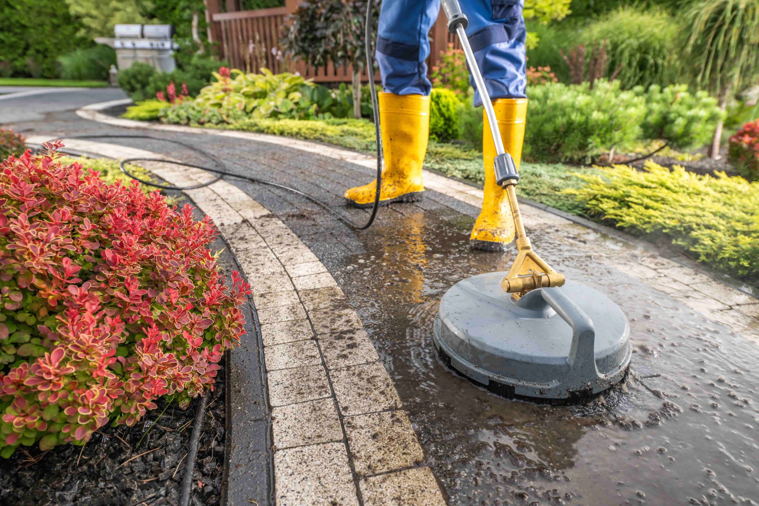 garden-worker-pressure-washing-decorative-bricks-g-2023-11-27-05-03-02-utc (1)