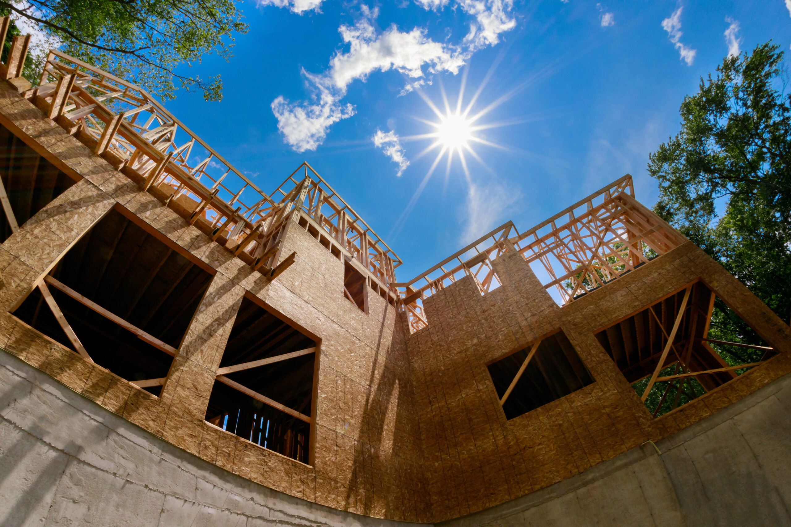 Truss frames of stick house provide excellent structural support for timber beams.