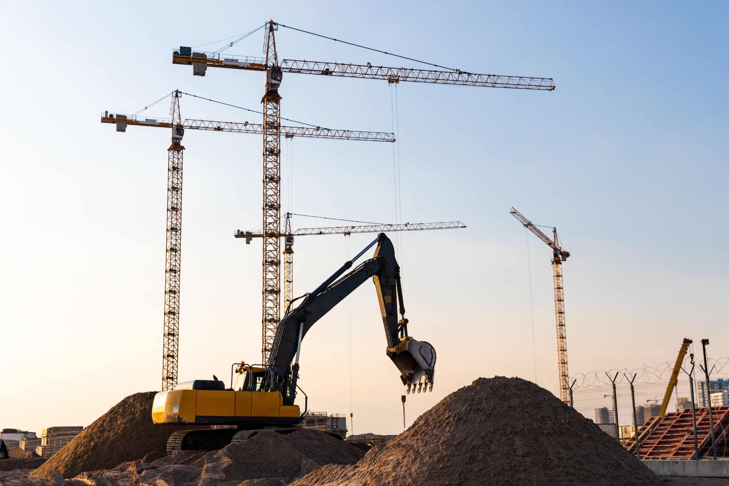 tower-cranes-and-excavator-silhouette-at-construct-2023-11-27-05-24-38-utc (1)