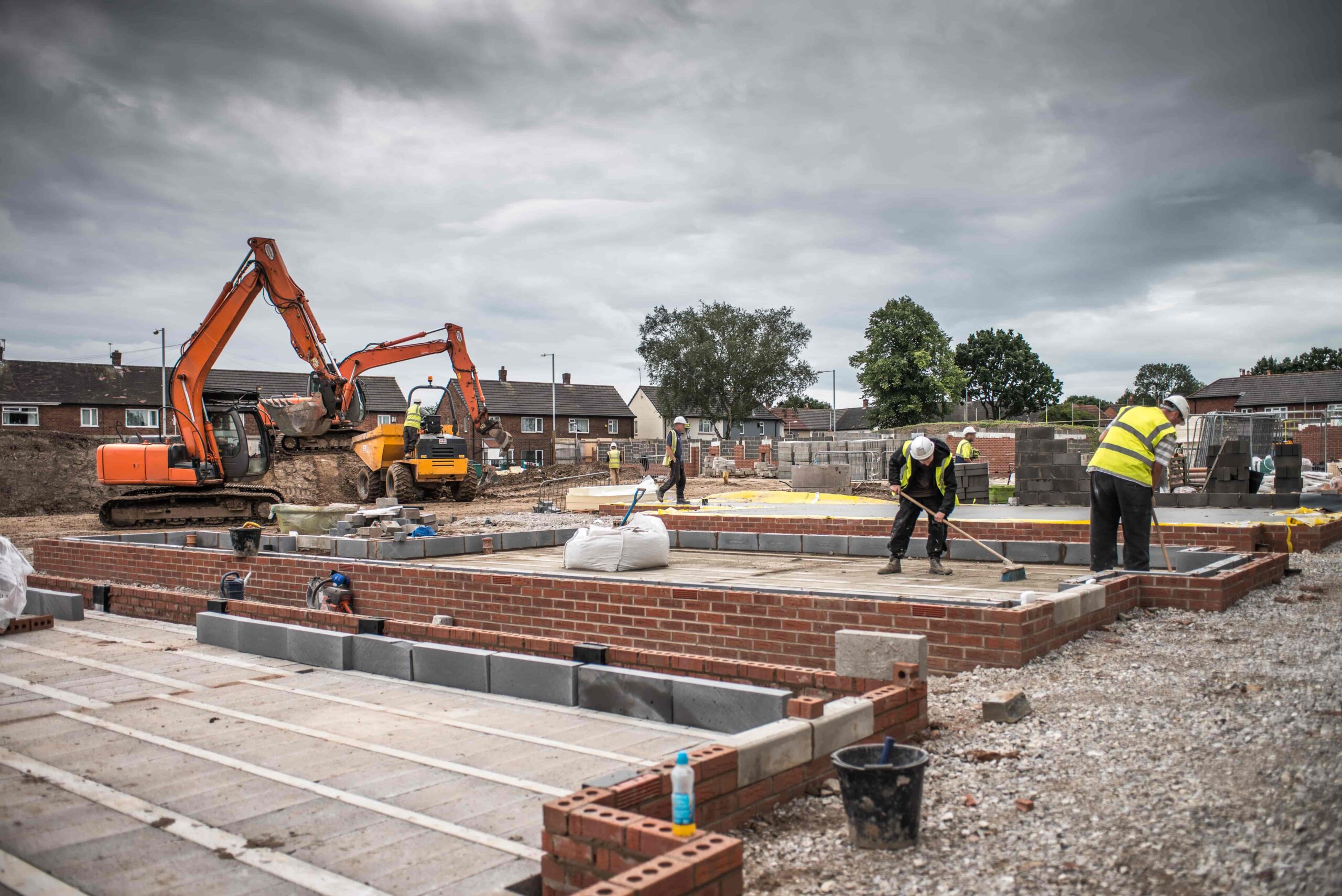 workers-laying-bricks-on-construction-site-2023-11-27-05-33-10-utc